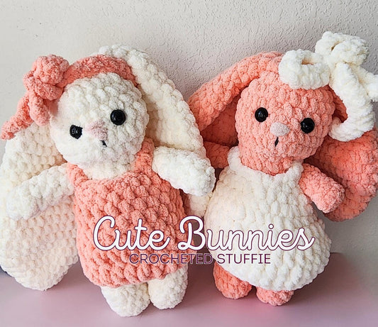 Cute crochet bunnies wearing crocheted dresses and headband bows. One is pink and one is white, alternating those colors.